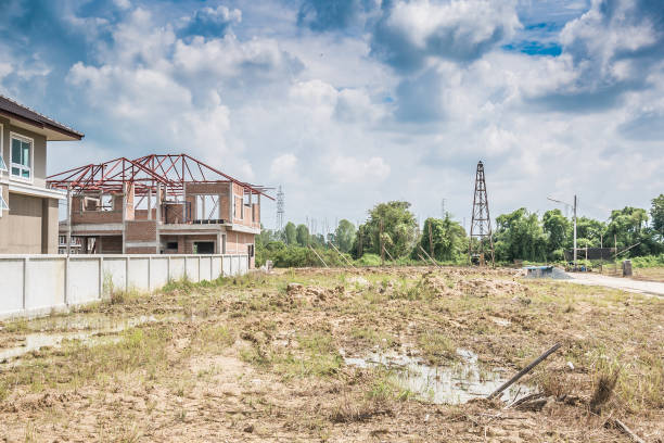 istock Residential new house building at construction site with clouds and blue sky 929304988