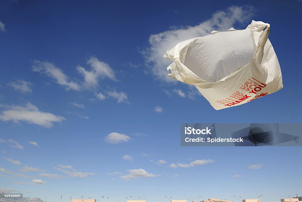 Flying Grocery Bag Flying grocery bag over New Mexico sky. Plastic Bag Stock Photo