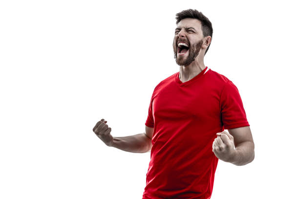 вентилятор / спортивный игрок на красной форме празднования на белом фоне - soccer sport football fan стоковые фото и изображения