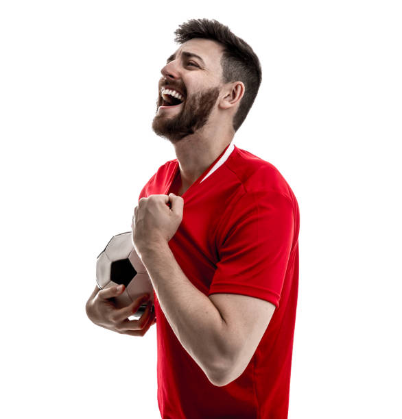 istock Fan / Sport Player on red uniform celebrating on white background 929308060