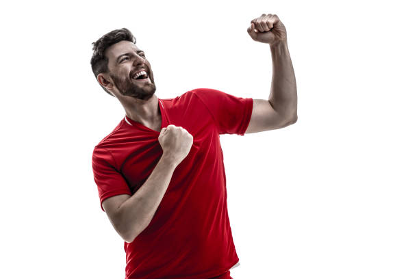 istock Fan / Sport Player on red uniform celebrating on white background 929308068