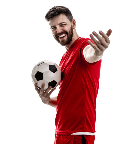 Photorealistic 3d render of a soccer ball textured with German flag isolated on white background. Soccer ball is lit by the upper left corner of the composition and casting shadows on white ground. Horizontal composition with copy space. Clipping path is included.
