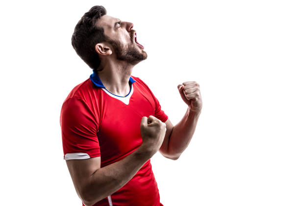 istock Fan / Sport Player on red uniform celebrating on white background 929308154