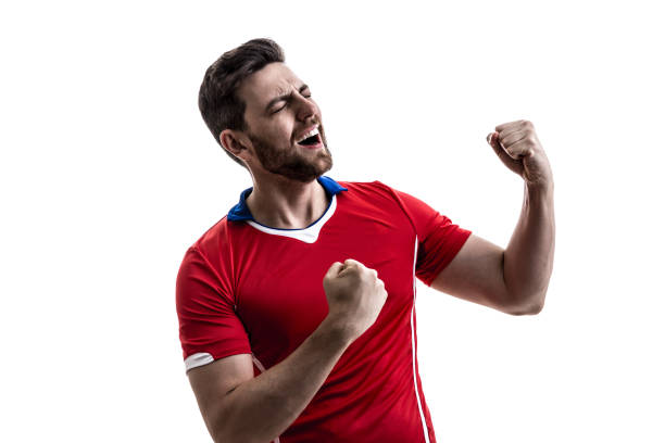 istock Fan / Sport Player on red uniform celebrating on white background 929308156