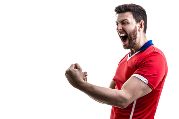 istock Fan / Sport Player on red uniform celebrating on white background 929308162