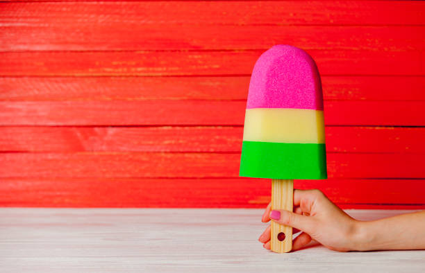 Female hand holding fake ice-cream