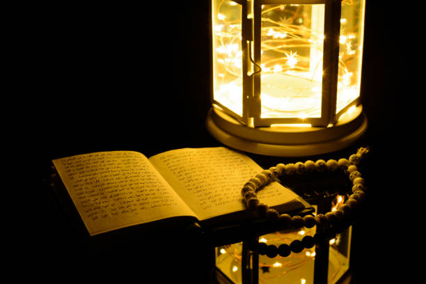 istock Bright lantern and Holy Book Quran. Ramadan Kareem background 929334350