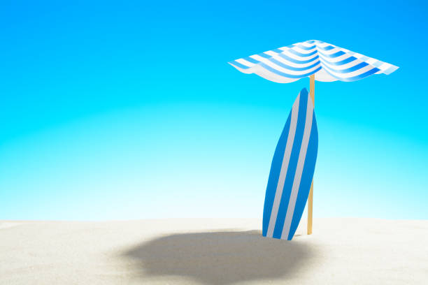 istock Surfboard under an umbrella on the sandy beach, sky with copy space 929334446