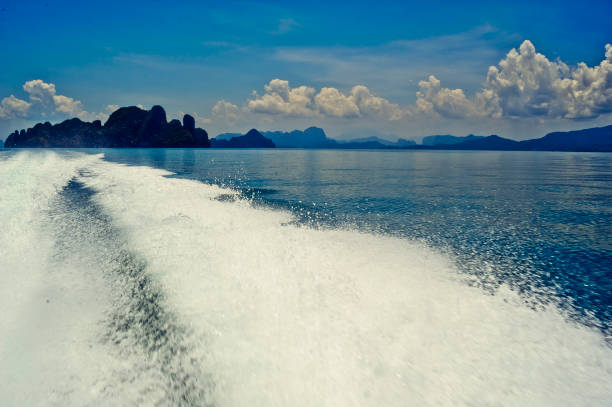 istock High-speed motorboat wake trails and Phang Nga Bay 929432828