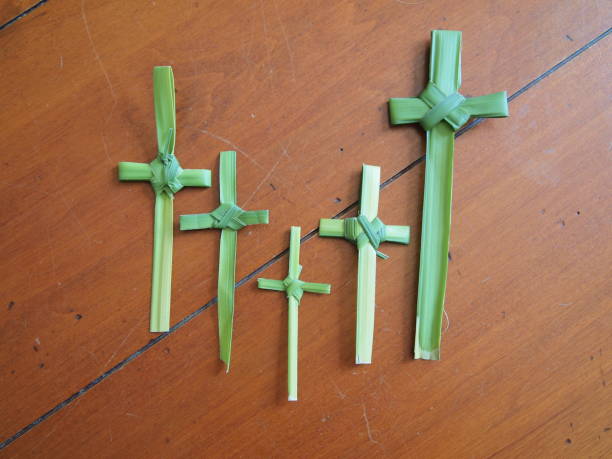 istock Grouping of handmade fresh palm leaf crucifix 929435424