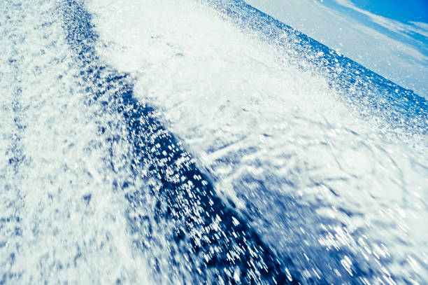 The speedboat galloped and tilted its bow, leaving behind waves