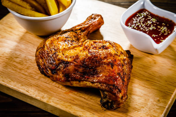 istock Fried chicken drumstics with French fries 929444836