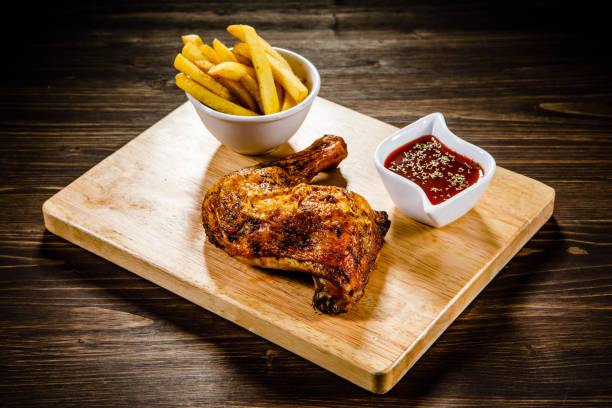 istock Fried chicken drumstics with French fries 929444928