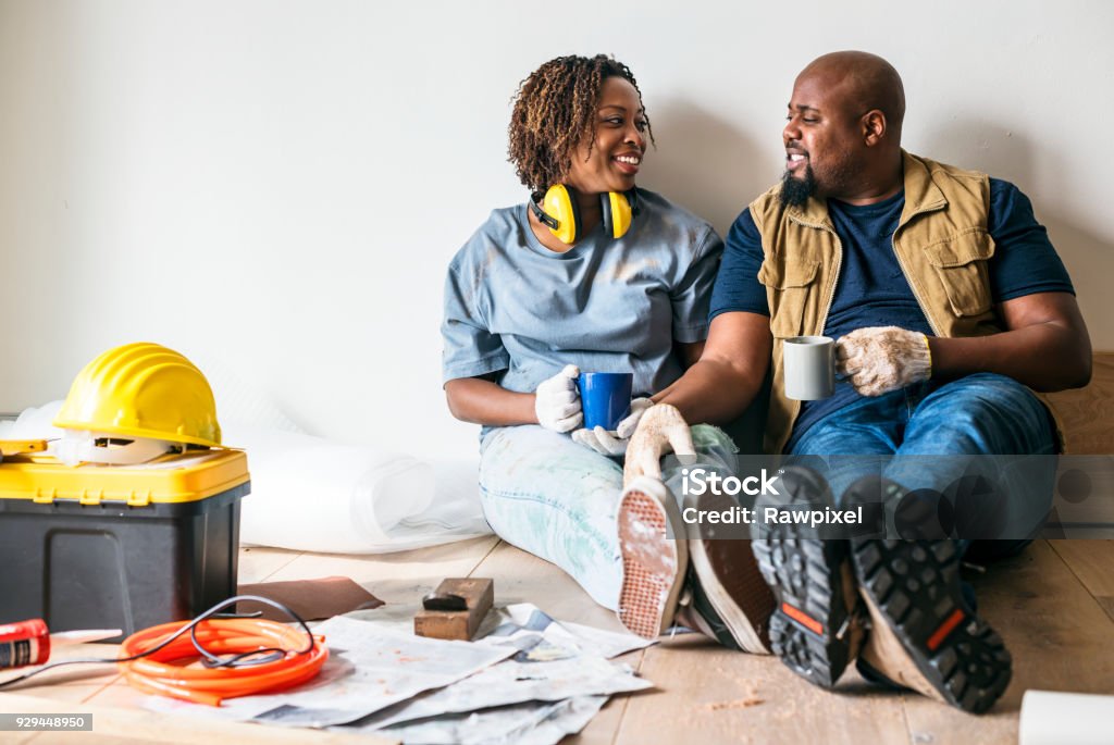 Couple moving into new house Home Improvement Stock Photo