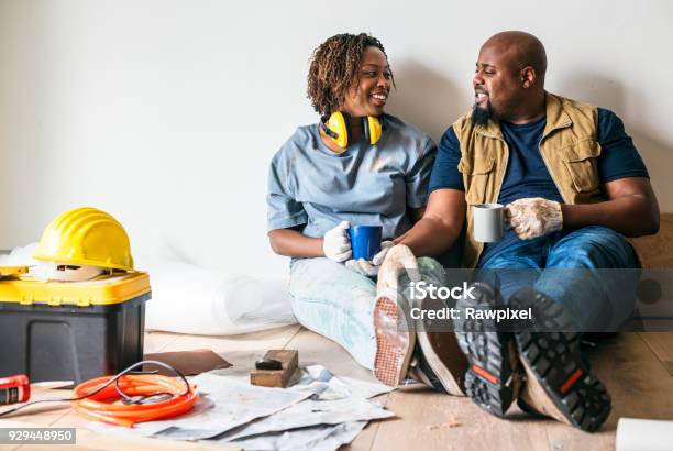 Couple Moving Into New House Stock Photo - Download Image Now - Home Improvement, Renovation, Residential Building