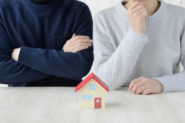 Photo of Couple thinking about house problem