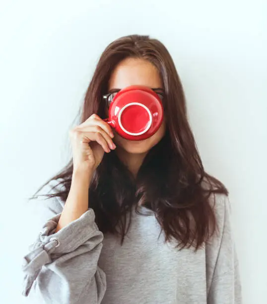 Photo of Woman enjoying her morning coffee