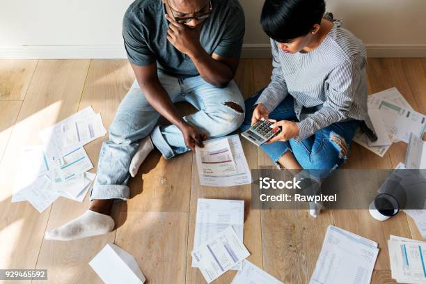 Couple Managing The Debt Stock Photo - Download Image Now - Finance, Debt, Problems