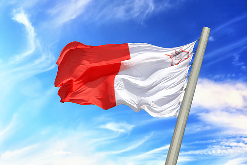 Flag of Malta against the background of the sky