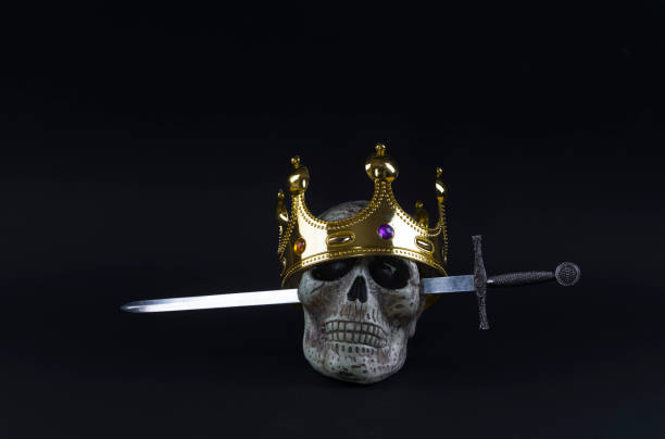 crown, sword and skull on a black background
