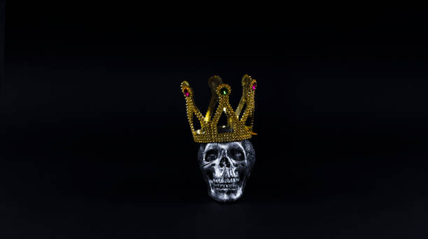 istock crown and skull on a black background 929477218