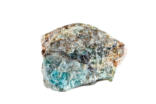 Macro shooting of natural gemstone. Raw mineral Apatite. Madagascar. Isolated object on a white background
