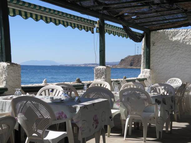istock Empty Restaurant with view of sea 929483250