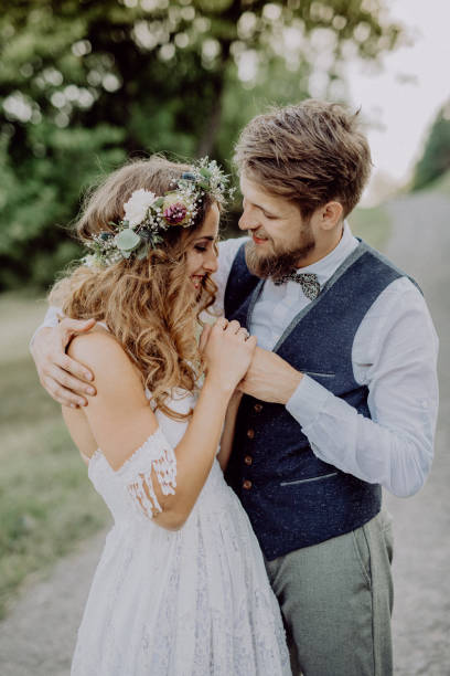 istock Beautiful bride and groom in green nature. 929489620