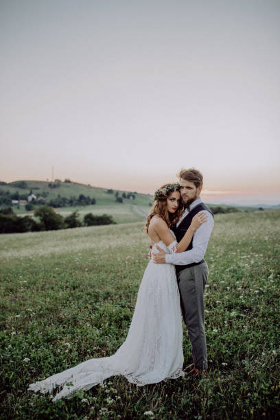 istock Beautiful bride and groom at sunset in green nature. 929489854