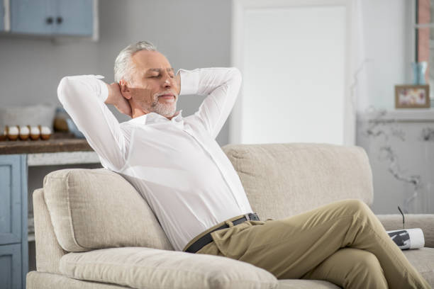 istock Relaxed pensioner having rest at home 929490618