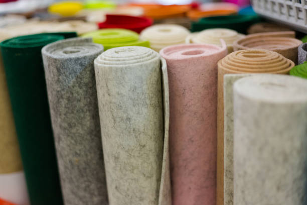 many colorful textile felt spools for sell view at colorful textile fels spools inside shop felt textile stock pictures, royalty-free photos & images