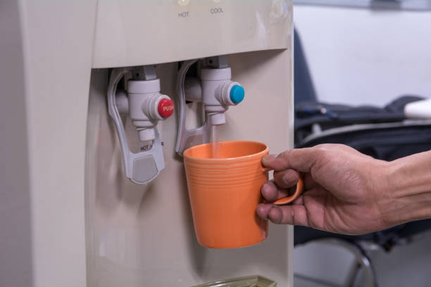 istock drinking water is poured from water cooler 929494774