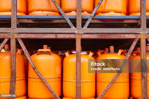 Used Gas Butane Cylinder Containers In Orange Tone Stock Photo - Download Image Now - Canister, Butane, Gas
