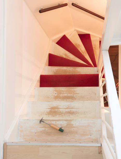 istock Removing carpet, glue and paint from an vintage stairs 929502310