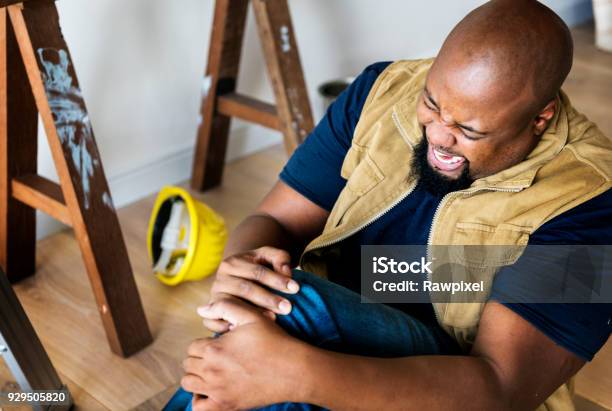 A Person Getting Injured Stock Photo - Download Image Now - Physical Injury, Occupation, African Ethnicity