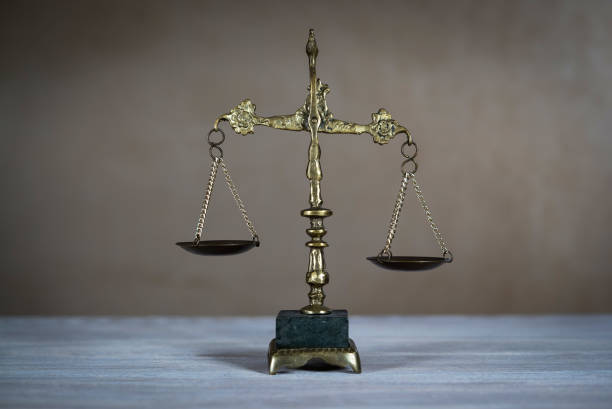 istock Law and Justice concept. Gray stone background, reflections on the floor, place for typography. Courtroom theme. 929506068