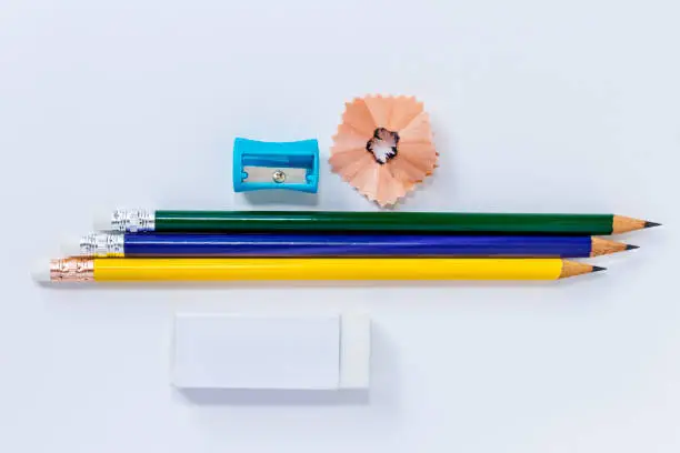 pencil-sharpener, eraser, and many pencils isolated on white paper background. with copy space for your text.