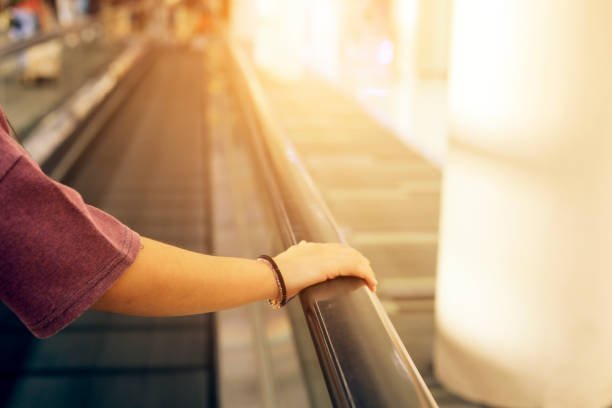 istock hand on railing in the airport 929518560