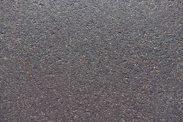 istock New wet black asphalt road surface from above 929518978