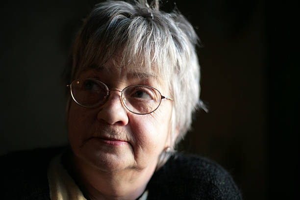 istock aged woman low light portrait 92951899