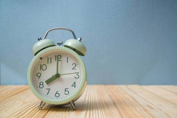 istock Retro vintage alarm clock on wood table, time concept. 929519230