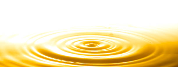 goccia e increspatura in oro liquido, sfondo astratto - honey abstract photography composition foto e immagini stock