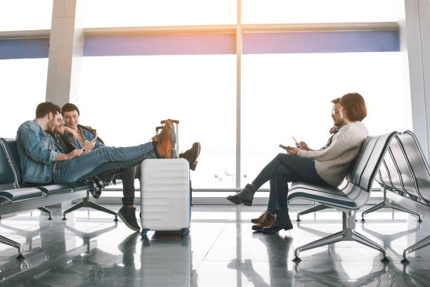 istock Cheerful people waiting for plane in airport 929528718
