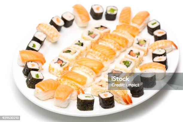 Single Plate Full Of Sushi At A Fish Buffet On White Background Stock Photo - Download Image Now