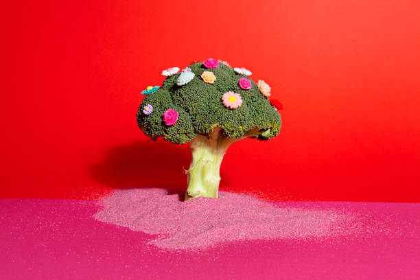 istock pink red broccoli flowers and sand 929532694