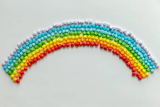 istock Colorful origami stars forming a rainbow background 929537096