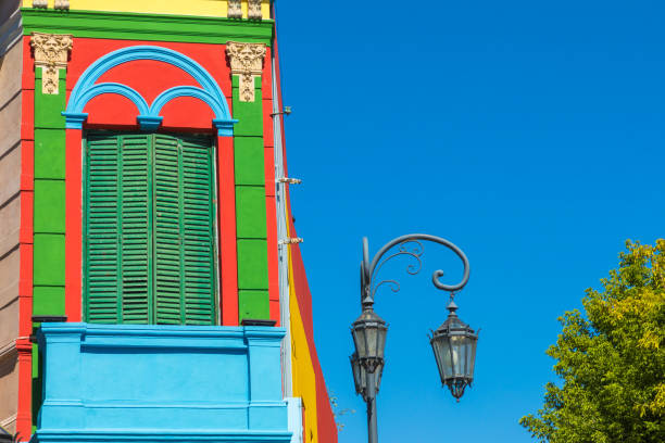 Colorful area in La Boca neighborhoods in Buenos Aires. Street is a major tourist attraction & the area is filled with colorfully painted buildings. Colorful area in La Boca neighborhoods in Buenos Aires. Street is a major tourist attraction & the area is filled with colorfully painted buildings. la boca stock pictures, royalty-free photos & images