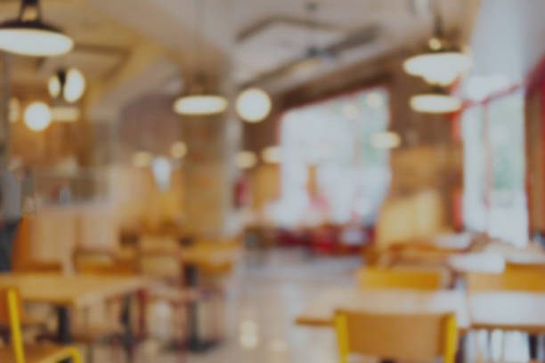 istock Abstract blur and defocused restaurant interior, coffee shop or cafe for background with bokeh lights 929541212