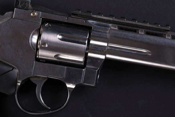 istock revolver on a black background 929542198