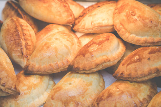 istock Traditional Empanadas stuffed with minced beef, pepper and corn, served with Aji Picante sauce 929542562